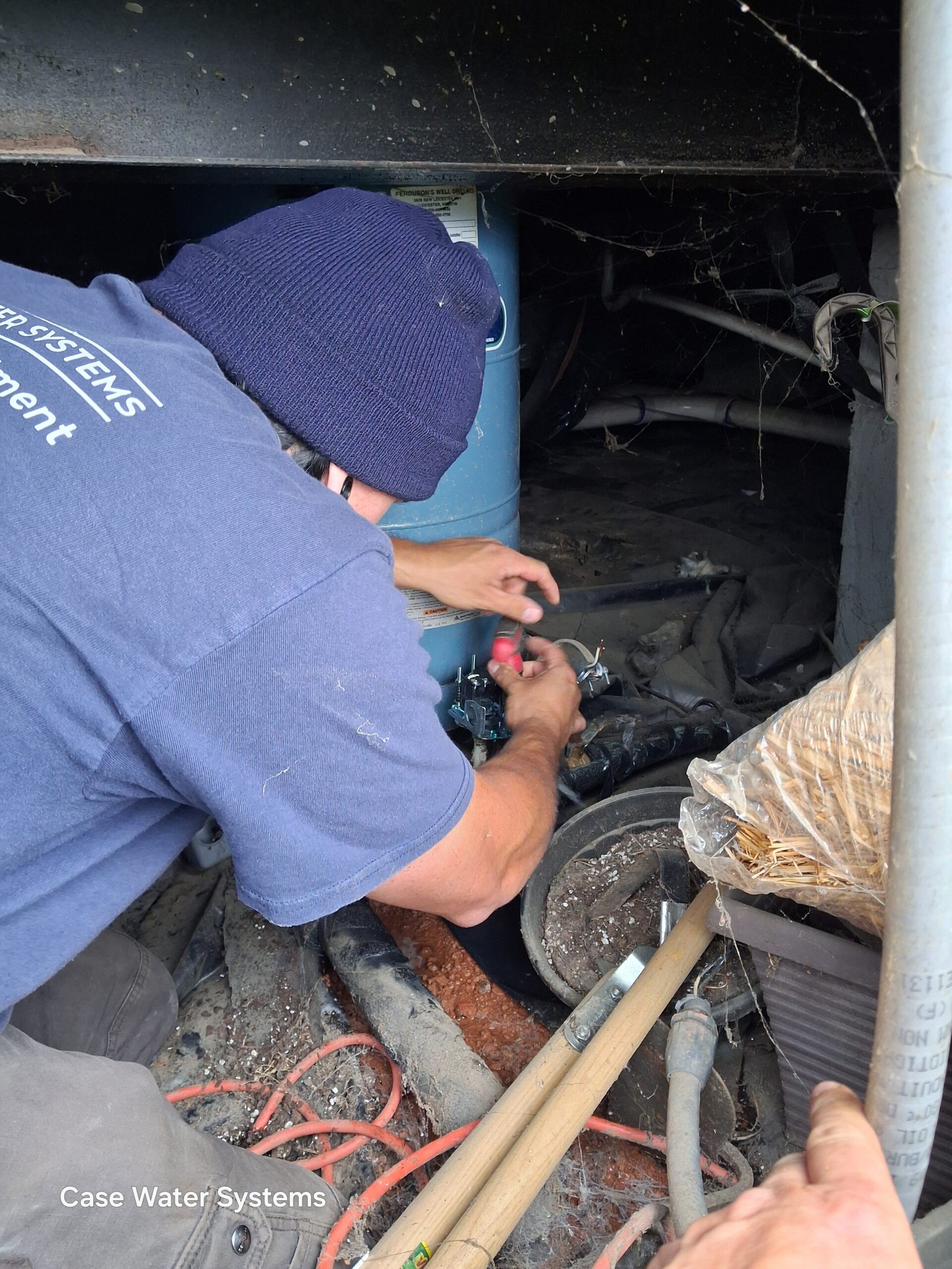 Case Water Systems technician servicing private well pressure equipment