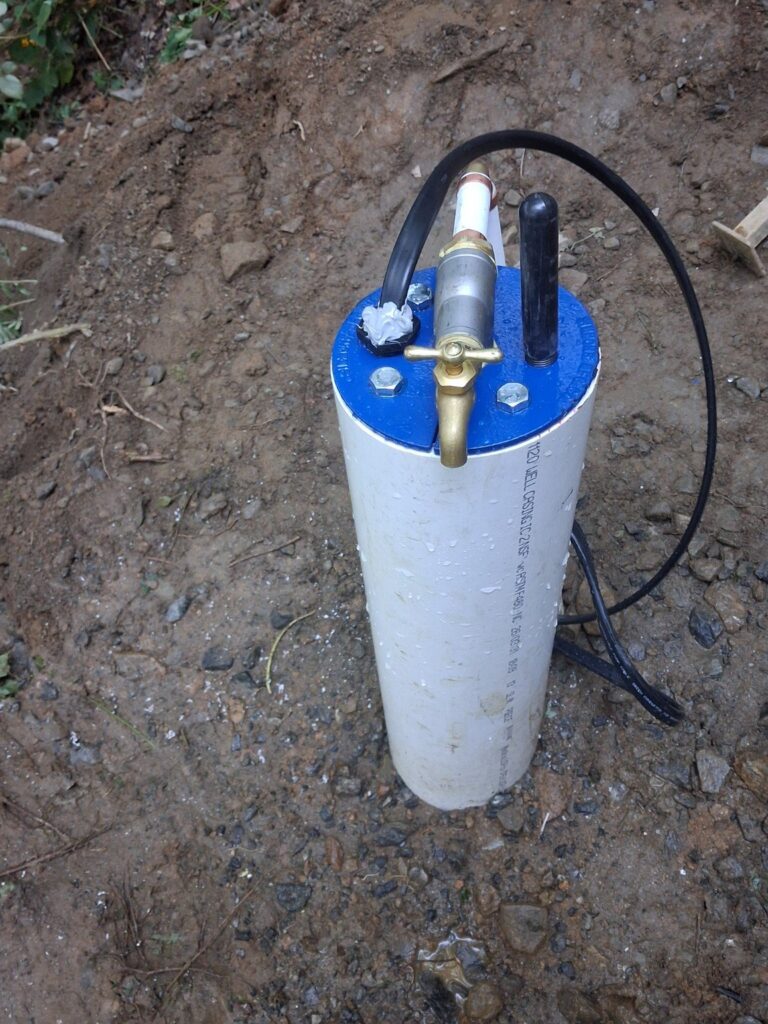 Private well casing and seal in a Case Water Systems field photo